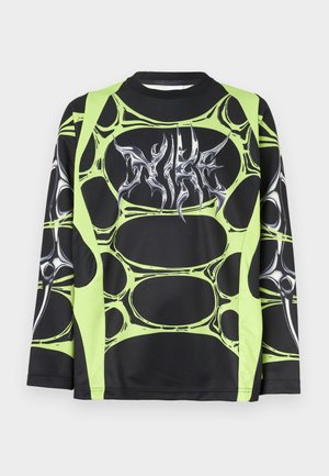 Long-sleeve black sports top featuring green abstract pattern, silver graphic logo. Made from lightweight, stretchy material.