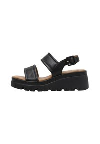 Sandalias de cuero negro con dos correas anchas, hebilla ajustable en el tobillo y una suela de plataforma gruesa. Textura suave y diseño minimalista.