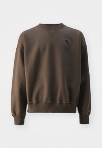 Hnědá mikina se žebrovaným výstřihem a manžetami, na hrudi s malým černým logem. Vyrobena z měkké látky, volný styl.