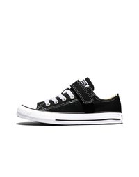Black low-top sneaker with white laces, a Velcro strap, and white rubber sole featuring black stripe details.