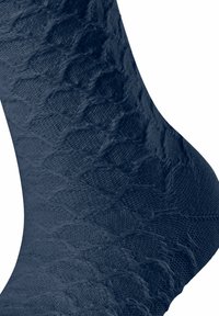 Dark blue sock made of textured fabric, featuring a diamond pattern. The material appears soft with a slight sheen, emphasizing its knit design.