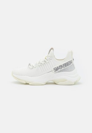 White athletic shoes with a textured mesh upper, silver accents, and a patterned sole. Features laces and a side design detail.