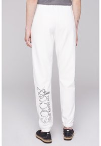 Soccx MIT GLITTER PRINT - Pantalones deportivos - ivory