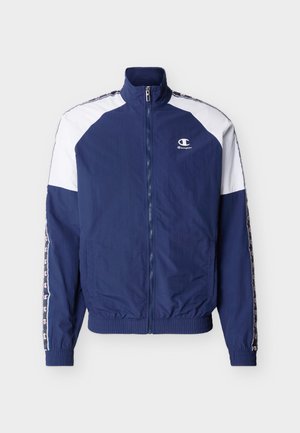 Marineblauw-wit jack met ritssluiting, hoge kraag, elastische manchetten en zoom, Champion-logo op de linkerborst en logo's op de mouwstrepen.