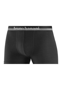 Svarta boxershorts i mjukt tyg med en åtsittande passform och elastisk midjeband som har en silverlogotyp. Slät textur utan synliga mönster.