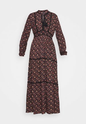 Μαύρο μακρύ φόρεμα με λουλούδια, με μακριά μανίκια, ραφές με φάσες και άνοιγμα μπροστά. Διαθέτει πολυχρωματικά λουλουδάτα μοτίβα και δαντελένιες λεπτομέρειες.