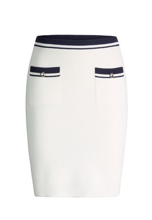 White knitted pencil skirt with navy waistband and pocket trims, featuring two front pockets with decorative buttons.