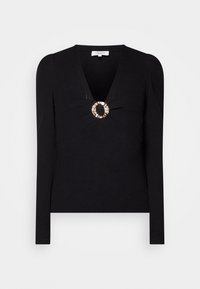 Schwarzes langärmliges, geripptes Strickoberteil mit V-Ausschnitt und dekorativem großen goldenen Ring detail in der Mitte vorne.