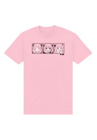 Różowy bawełniany t-shirt z trzema twarzami animowanych postaci obrysowanymi na czarno, każda z inną mimiką.