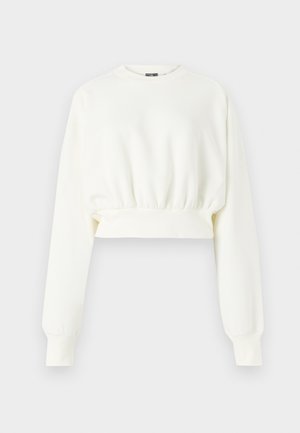 White cropped sweatshirt with long sleeves, ribbed cuffs, a round neckline, and gathered texture at the hem. Soft fabric finish.