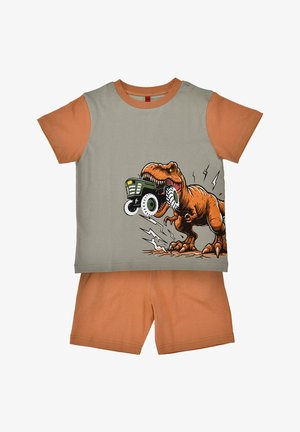 Short-sleeve gray and orange kids' outfit with a roaring T-Rex biting a green tractor on the shirt front, paired with solid orange shorts.