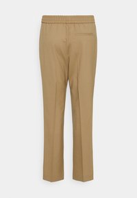 Bruine op maat gemaakte broek met een elastische tailleband en een enkele achterzak. Makkelijk stof met een taps toelopend ontwerp.
