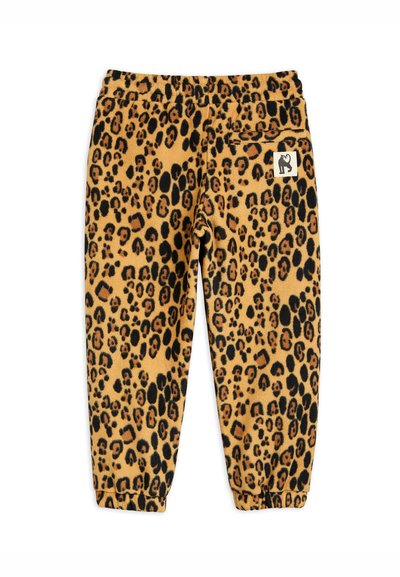 Fleecebukser med leopardskriftmønster, lys brun bunnfarge, elastisk midje, ribbede mansjetter og et lite logo-lapp på lommen.