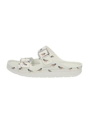 White slide sandal featuring bird illustrations, two adjustable silver buckles, a textured white sole, and a smooth upper material.