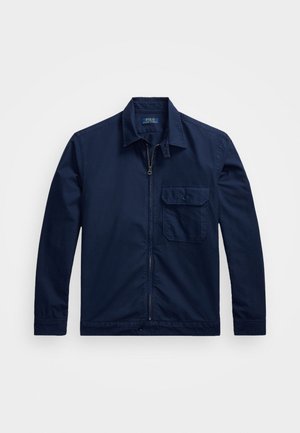 Mørkeblå langærmet jakke med krave, lynlås foran og brystlomme med knappelukning fra Polo Ralph Lauren.