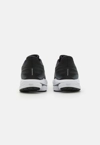 Black and gray athletic shoes with a textured mesh upper, a white midsole, and a patterned outsole. Features logo detail on the side.