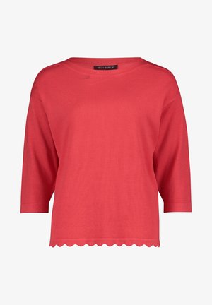 Coral knit top with a wide neckline, three-quarter sleeves, and a scalloped hem. Material appears soft with a smooth texture. Brand label visible.