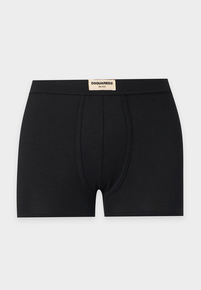 Boxer noir pour homme avec une poche avant profilée et une étiquette beige sur la ceinture portant l'inscription DSQUARED2 MILANO.