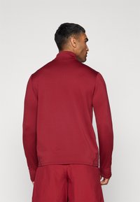 Under Armour VANISH 1/4 ZIP - Langærmet T-shirt - cardinal