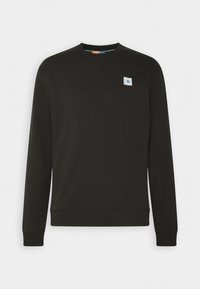 Sudadera negra hecha de una mezcla de algodón, con cuello redondo, mangas largas y un pequeño parche de logo en el lado izquierdo del pecho.