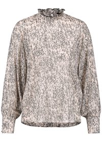 Blouse en tissu transparent rose clair avec motif tacheté noir, col montant à volants et poignets élastiqués, offrant une coupe ample.