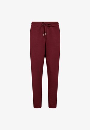 Burgundy sweatpants made of soft fabric, featuring an elastic waistband with a drawstring, tapered legs, and no visible pockets.