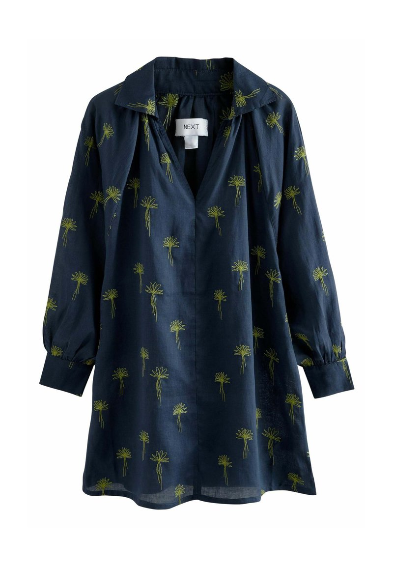 Marineblauwe button-up shirt met groene bloemembroideries, lange mouwen met elastische manchetten en een kraag. Kenmerkt zich door een relaxte pasvorm en lichte stof.