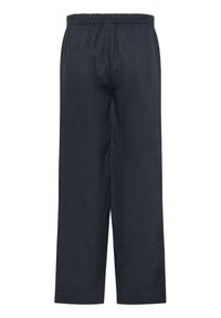 Dunkelblaue, weit geschnittene Hosen aus leichtem Stoff. Sie verfügen über einen elastischen Bund und eine glatte, strukturierte Oberfläche.