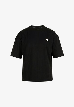 T-shirt noir à manches courtes avec petit logo gorille blanc sur le côté gauche de la poitrine et texte Gorilla Wear sur le col intérieur.