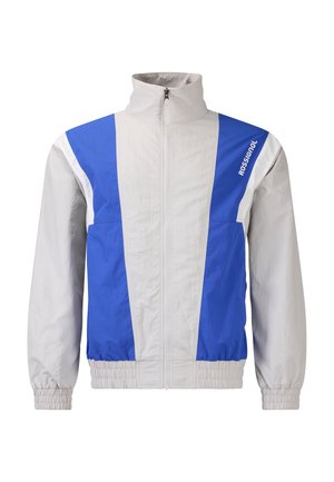 Lichtgrijze en blauwe windjack met ritssluiting, hoge kraag, elastische manchetten en het "Rossignol"-logo op de rechterbovenborst.