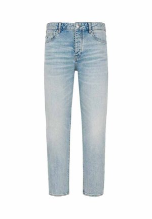 Jeans in denim blu chiaro con vestibilità dritta, dotati di cinque tasche, cuciture visibili e vita a media altezza. Senza decorazioni.