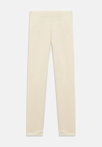 Ανοιχτό μπεζ κολάν από απαλό βαμβακερό υλικό, με εφαρμοστή σχεδίαση, ελαστική μέση και λεία, αδιάκοπη υφή.