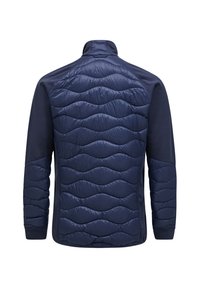 Navy jacket featuring a quilted front with wave pattern, solid back, and stand collar; made from a lightweight, smooth material.