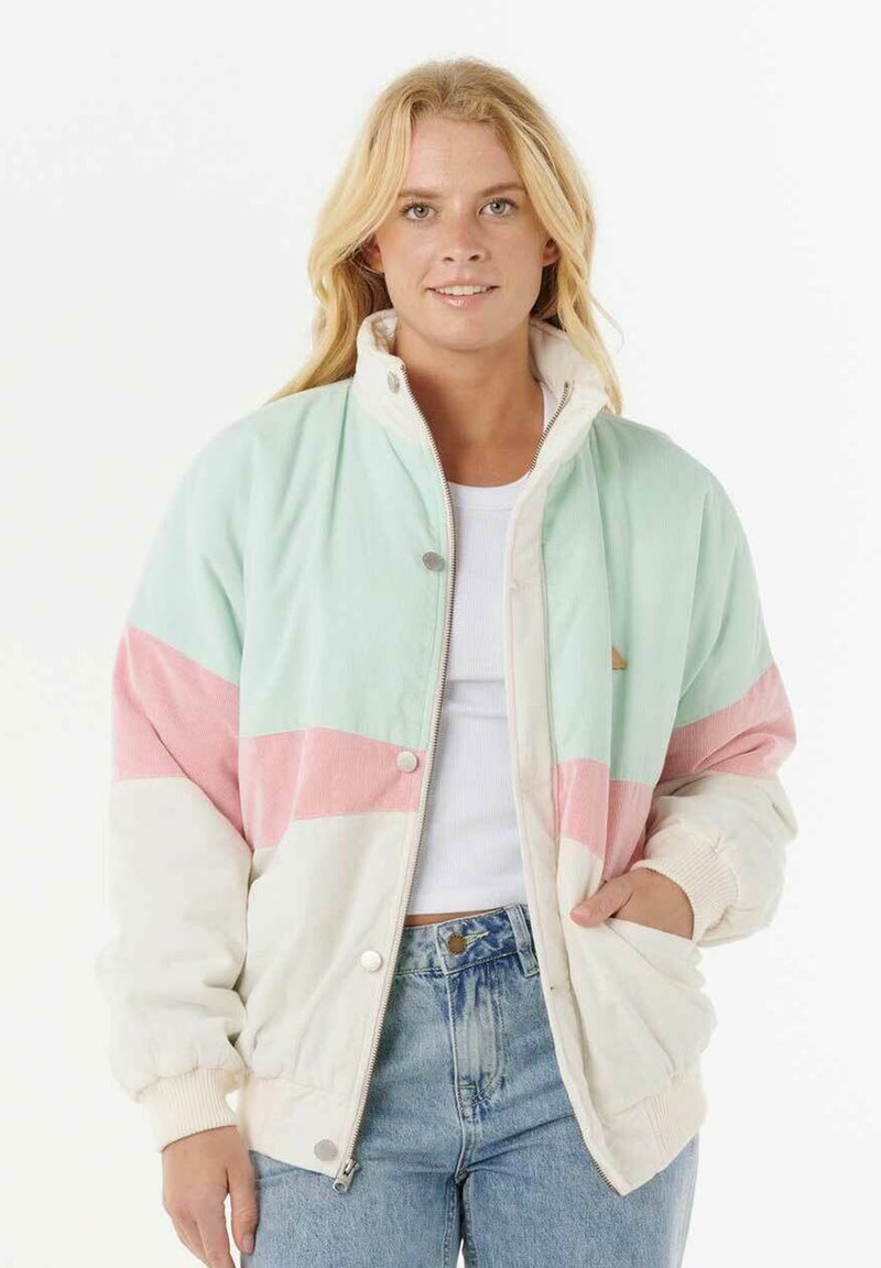 Giacca in corduroy verde menta, rosa e crema con colletto alto, bottoni a pressione e polsini elasticizzati. Presenta un design geometrico a blocchi di colore.