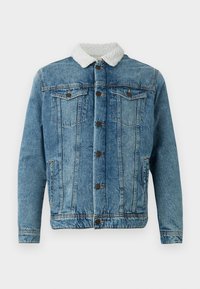 Jeansjacka i ljusblått med en fluffig vit krage, två bröstfickor, knäppning framtill och fint sydda detaljer.