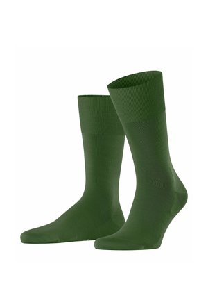 Paar schlichter dunkelgrüner Knöchelsocken mit gerippten Bündchen, dargestellt vor einem weißen Hintergrund.