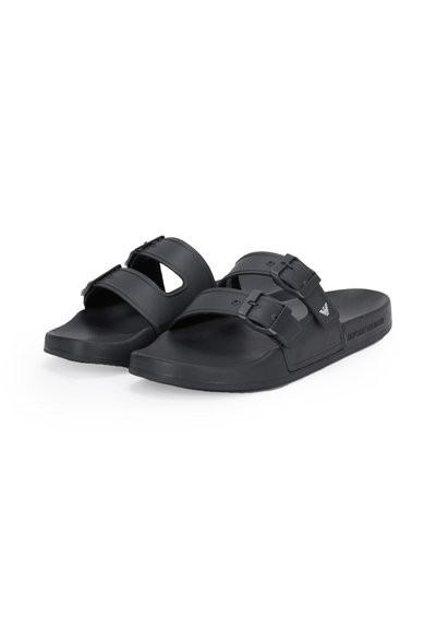 Black slide sandals with two adjustable buckle straps and contoured footbeds, featuring a subtle branded logo on the side.