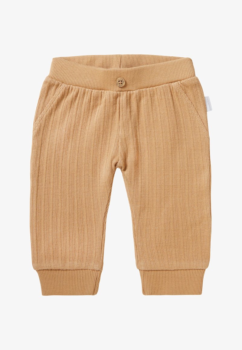 Tan geribde broek met een knoopsluiting, elastische tailleband en zijzakken. Zachte textuur met aangesloten manchetten bij de enkels.