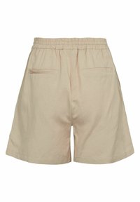 Beige Baumwollshorts mit einem elastischen Bund, zwei Gesäßtaschen und einer lockeren Passform, die eine glatte Textur und ein minimalistisches Design aufweisen.
