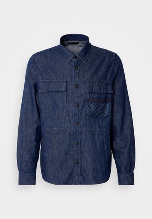 Herres denimskjorte, mørkeblå, lange ærmer, knaplukning foran, to brystlommer, tekstureret lomme, ensfarvet stof.