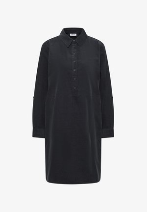 Musta pitkähihaisista corduroypaidasta valmistettu mekko, jossa on terävä kaulus, nappilista ja napitetut hihansuut. Polvimittainen, löysä malli.