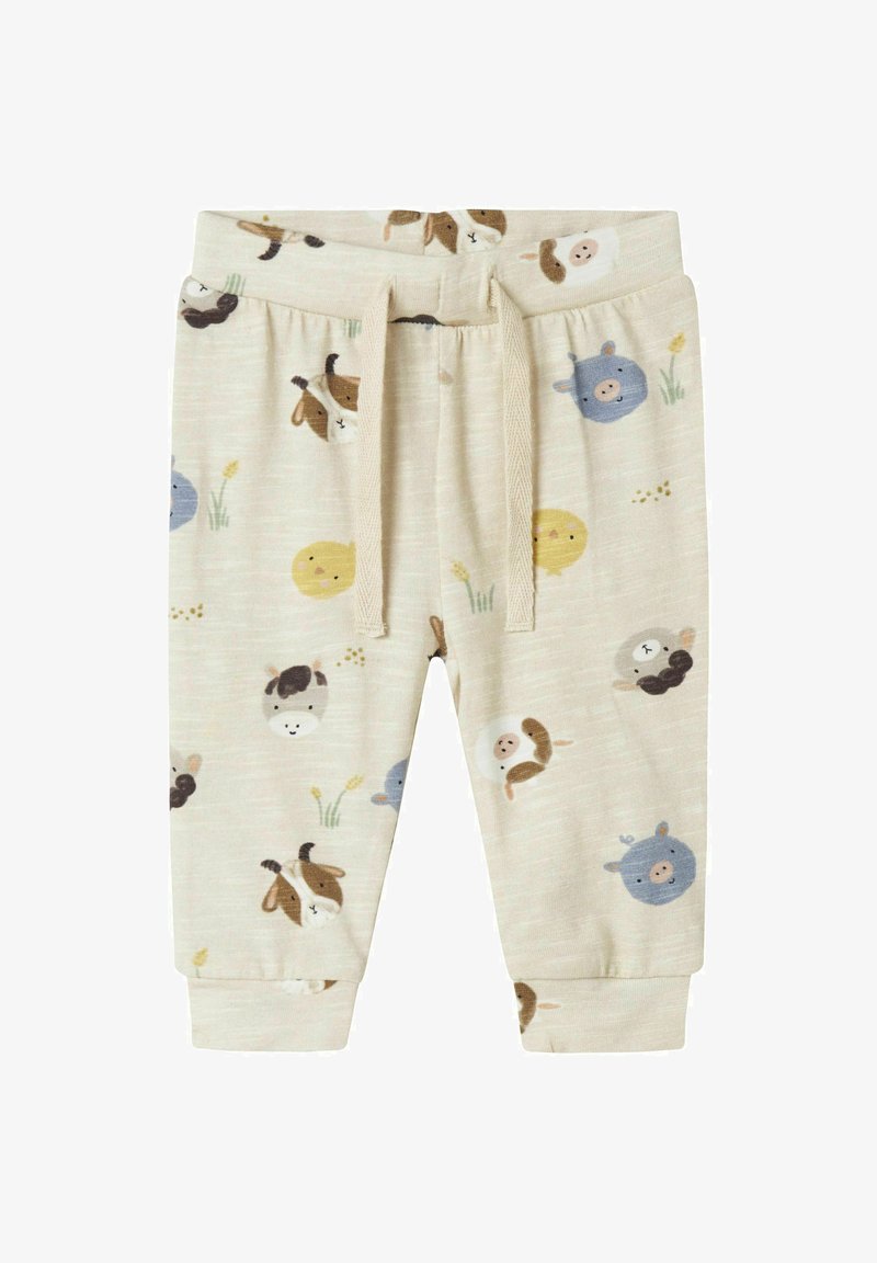 Cremefarbene Jogginghosen aus Baumwolle mit Tiermotiven, die in verschiedenen Farben wie Braun, Blau und Gelb gestaltet sind. Elastischer Bund mit Kordelzug.