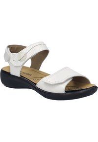 Hvide lædersandaler med velcrorem, åben tå og polstret indersåle. Har sort gummisål og syninger som accent.