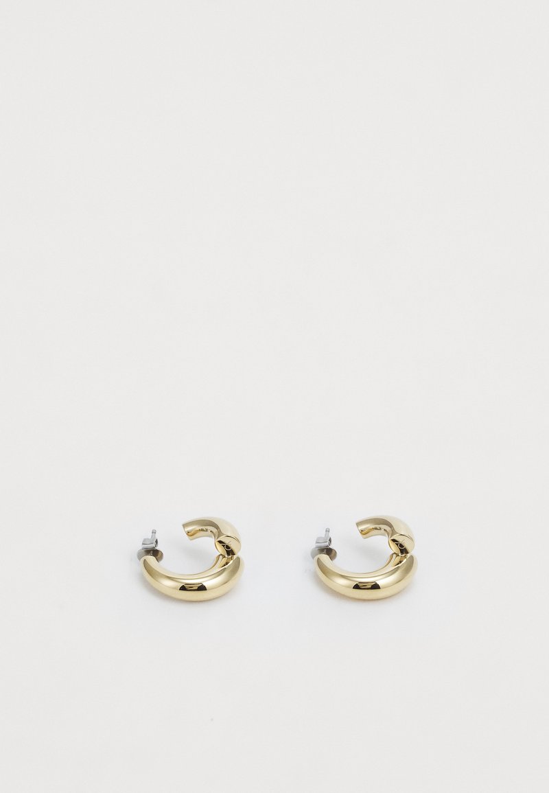 Gold hoop earrings with a polished finish and curved shape. Features a silver hardware clasp for securing. Suitable for everyday wear.
