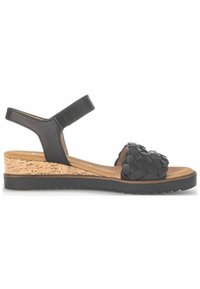 Sandali wedge neri in pelle con dettagli in cinghia intrecciata, base in sughero e suola in gomma con motivo a zigzag. Inclusa la cinghia regolabile alla caviglia.