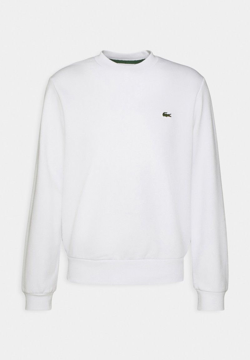 White crewneck sweatshirt made of cotton blend, featuring long sleeves and a small green embroidered logo on the left chest. Soft texture.