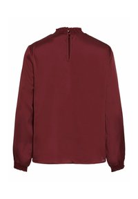 Burgundin pitkähiha blouse, jossa on smockattu kaula-aukko, avattava avainaukko selässä ja kerätty hihansuu, valmistettu sileästä ja kevyestä kankaasta.