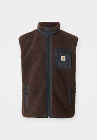 Brūns flīsa bezrūnas vestes jaciņa ar rāvējslēdzēju priekšā, augstu apkakli un sānu kabatām. Iezīmēta ar melnu krūšu kabatu ar logo etiķeti. Maigs, teksturēts materiāls.