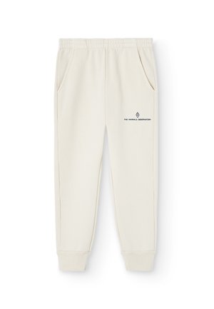 Sweatpants i cremefarve med elastisk talje og manchetter, sidelommer og et lille sort logo med teksten "The Animals Observatory" på højre ben.