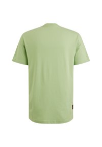 T-shirt vert clair en coton, avec un col rond classique, des manches courtes et un ourlet droit. Aucune motif ni accent visible.